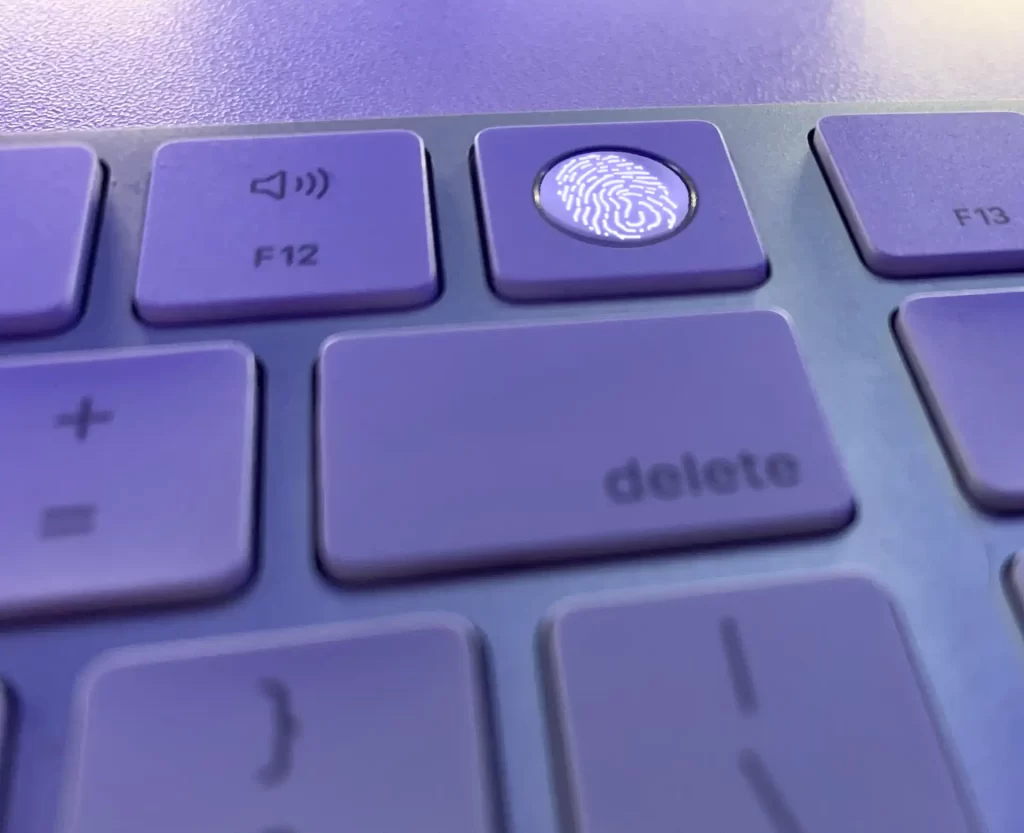 apple Magic Keyboard biometric scanner showing a fingerprint on the button